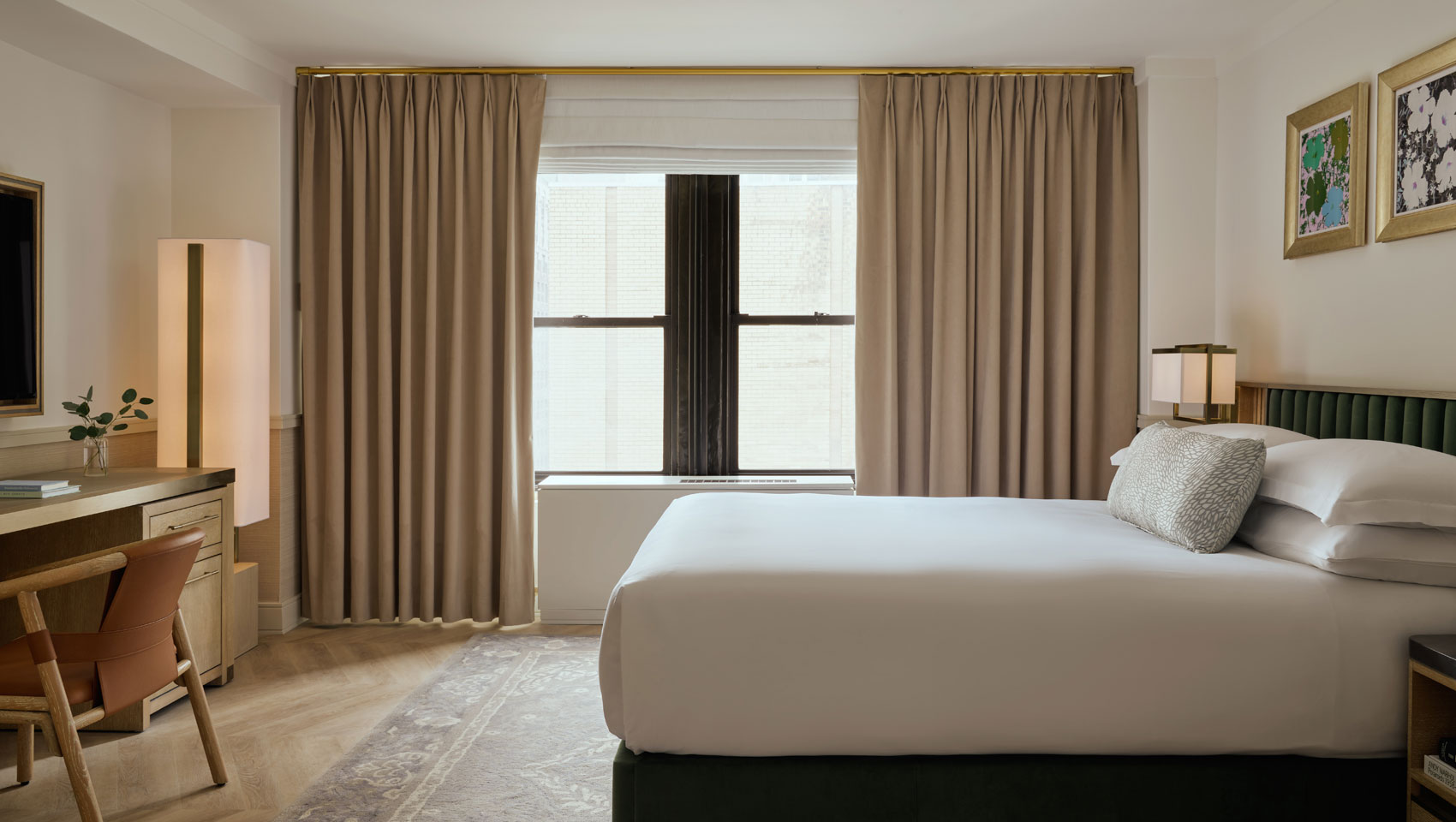Guestroom with bed and desk at Kimpton Ashbel Hotel