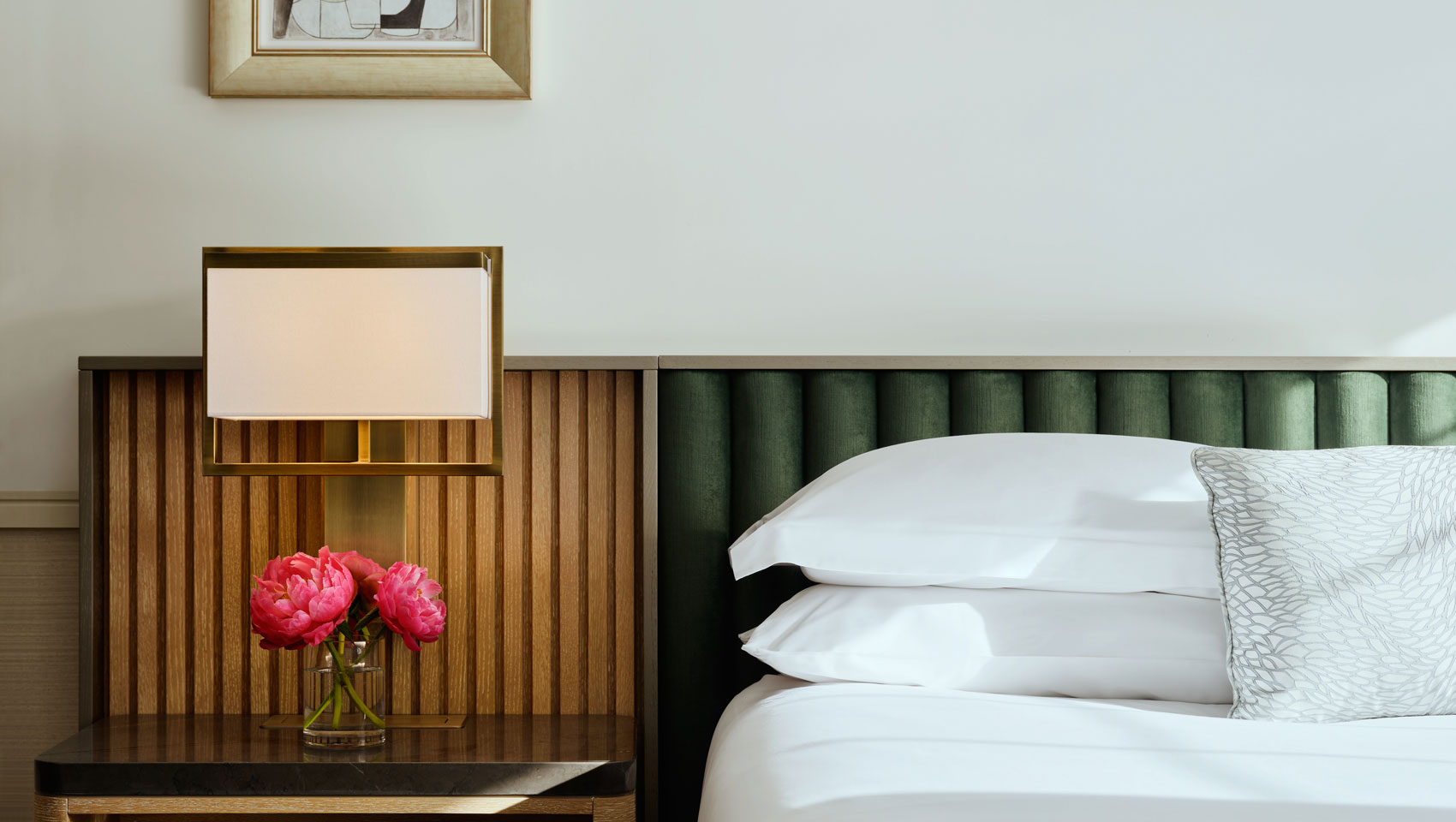 bed and side table at Kimpton Ashbel Hotel