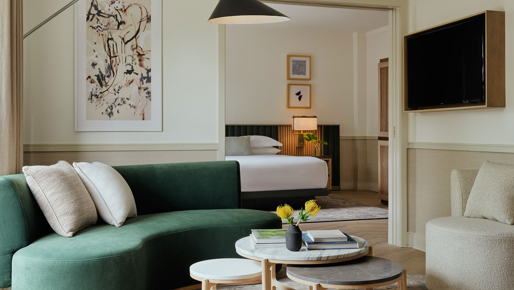 Modern hotel suite with chic lounge and serene bedroom