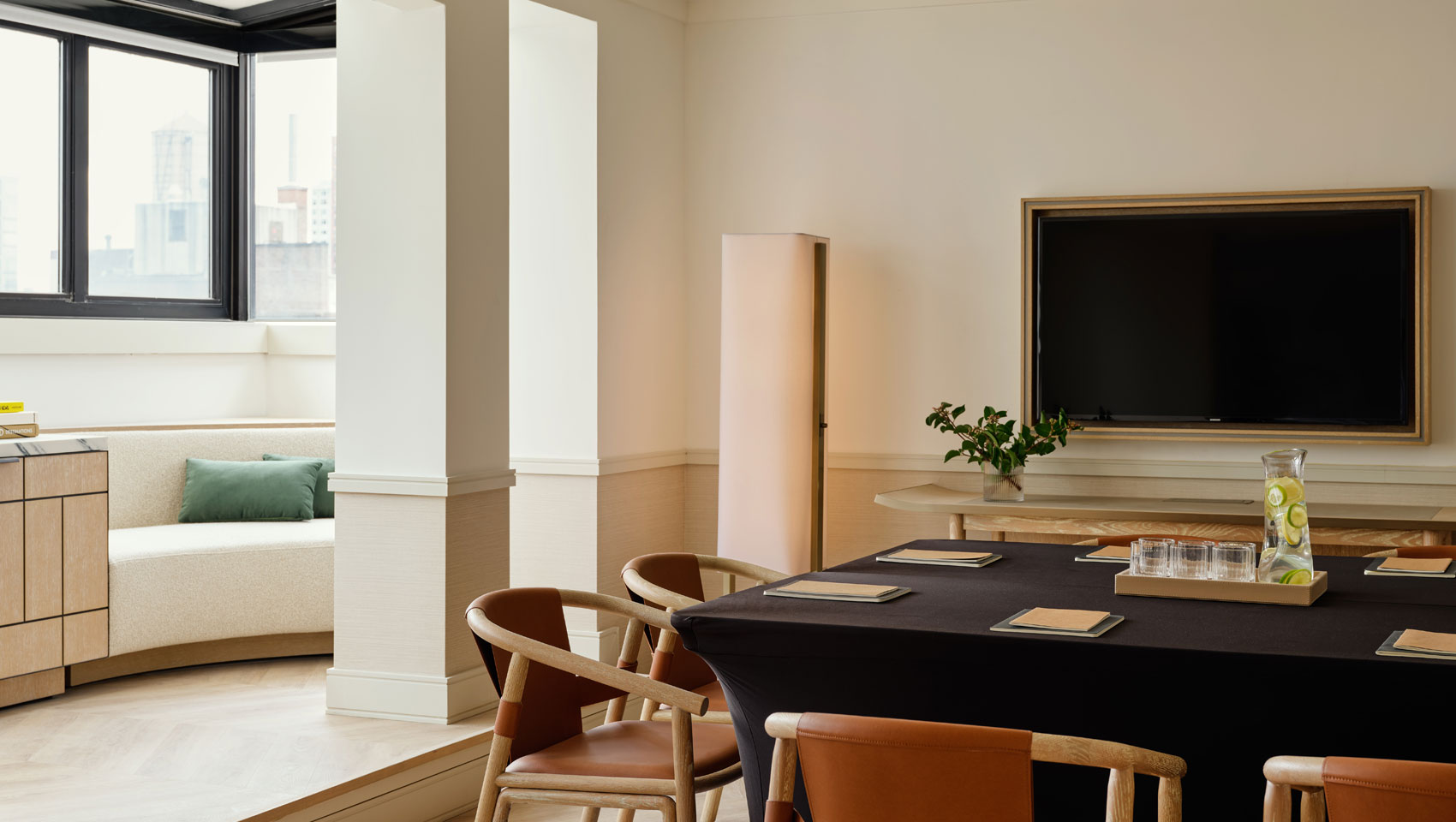 Suite dining table set up for a meeting alternate view with window seating at Kimpton Ashbel Hotel