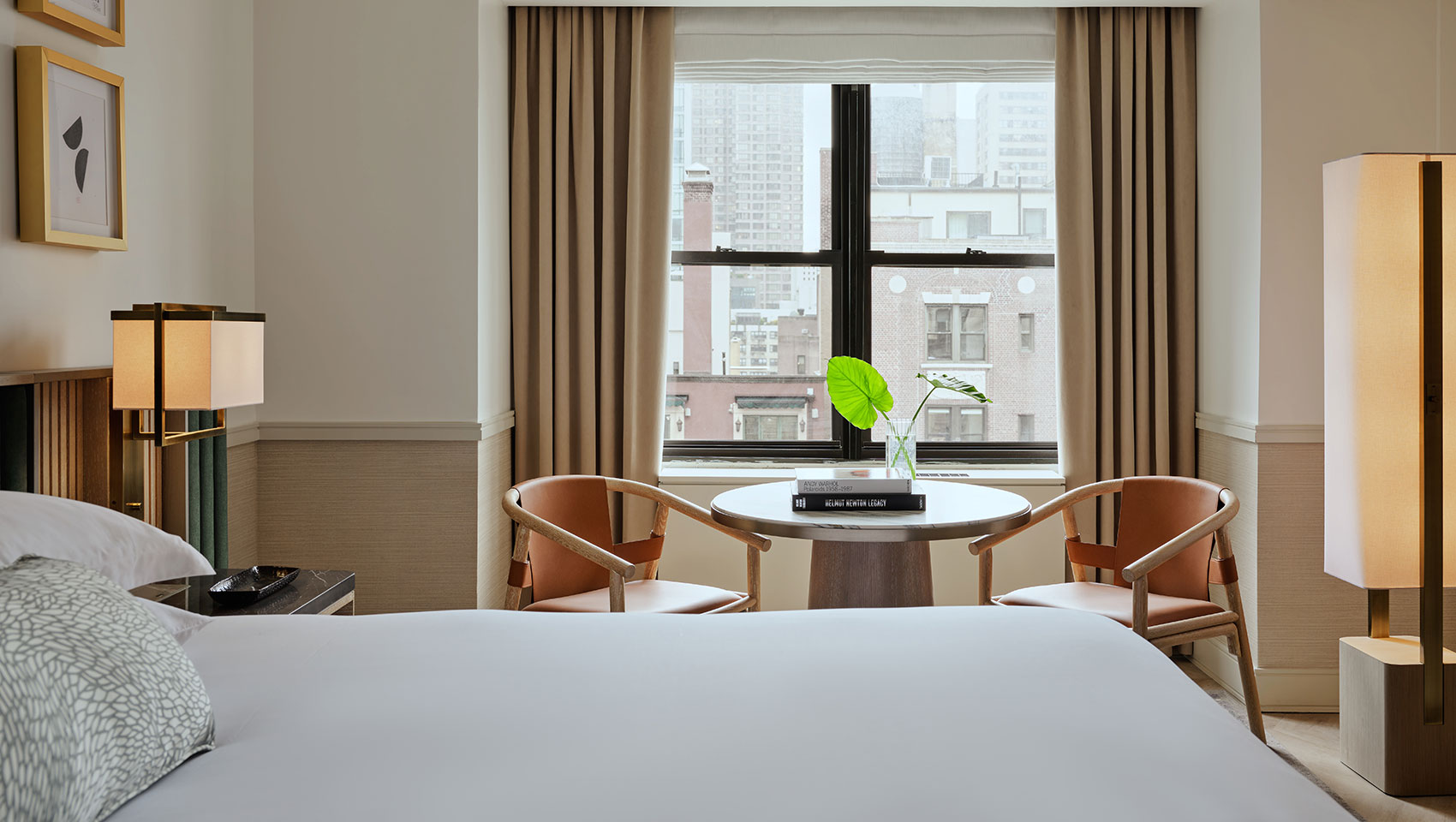 bed, table and chairs in Kimpton Ashbel guestroom